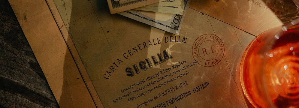 Eduardo's plans of Sicily with a glass of Negroni